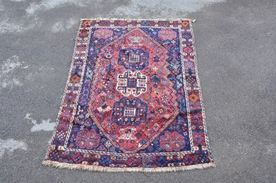 Lot 1482 - A Caucasian hand woven wool rug, with...