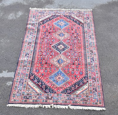 Lot 1476 - A Caucasian hand woven wool rug, with...