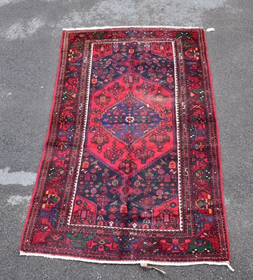 Lot 1483 - A Caucasian hand woven wool rug, with...