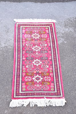 Lot 1492 - A Caucasian hand woven wool mat, with...