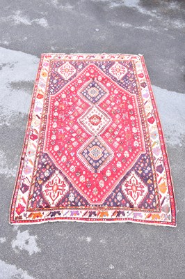 Lot 1478 - A Caucasian hand woven wool rug, with...