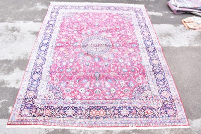 Lot 1462 - A Persian carpet with all over flower head...