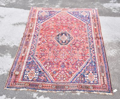 Lot 1465 - A Caucasian hand woven wool rug, with...