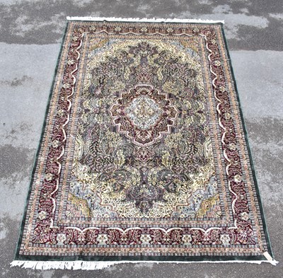 Lot 1464 - A Persian part silk rug, with flower head...
