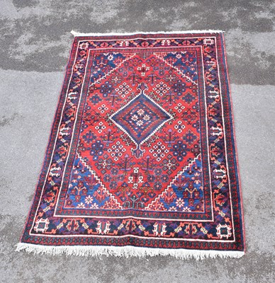 Lot 1481 - A Caucasian hand woven wool rug, with...