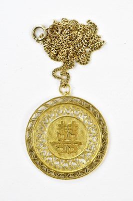 Lot 2447 - A Chinese yellow metal pendant on 9ct chain,...