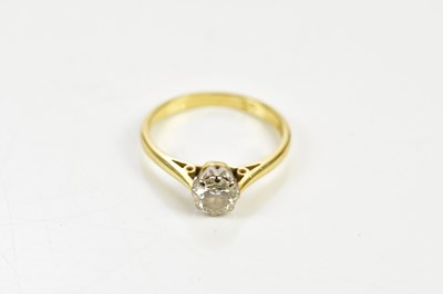 Lot 1385 - An 18ct yellow gold diamond solitaire ring,...