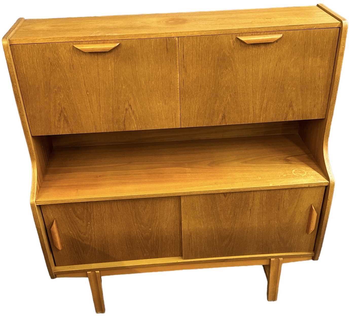 Lot 39 - A teak mid century drinks cabinet, with two...