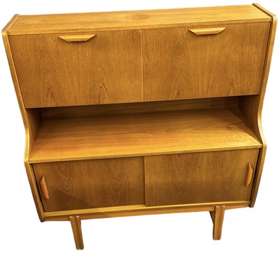 Lot 39 - A teak mid century drinks cabinet, with two...