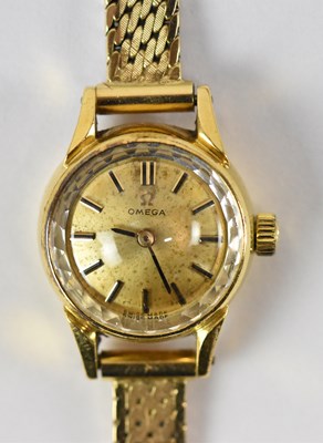 Lot 1641 - OMEGA; a lady's 14ct yellow gold wristwatch on...