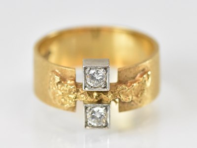 Lot 1452 - An 18ct yellow gold Finnish ring set with two...