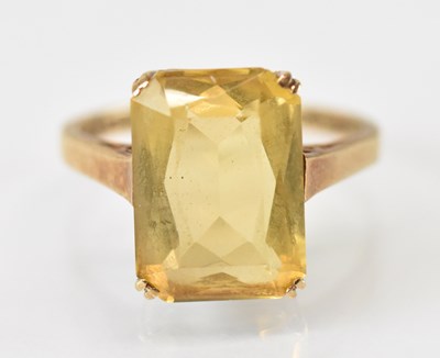 Lot 1520 - A 9ct yellow gold ring set with large central...