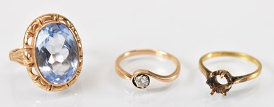 Lot 1474 - A yellow metal ring set with large central...