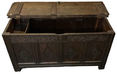 Lot 31 - An 18th century carved oak coffer, with hinged...