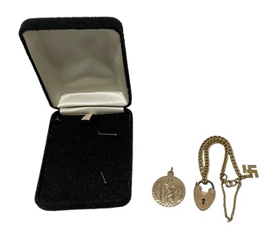 Lot 1551 - A 9ct yellow gold circular pendant with...