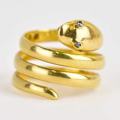 Lot 958 - An 18ct yellow gold coiled snake ring, set...