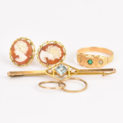 Lot 1017 - A 9ct gold bar brooch with blue bezel set...