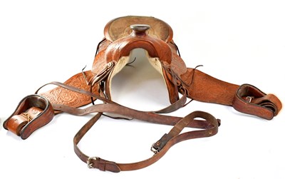 Lot 823 - A vintage tooled leather Western-style saddle...