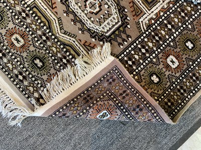 Lot 93 - A Persian silk cream and brown ground carpet...
