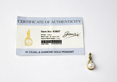 Lot 815 - A 9ct gold pearl and diamond pendant.