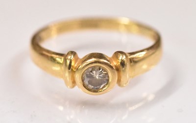 Lot 1453 - An 18ct yellow gold diamond solitaire ring,...