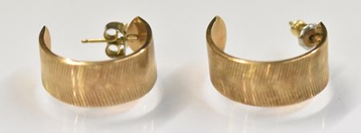Lot 1554 - A pair of yellow metal earrings, combined...
