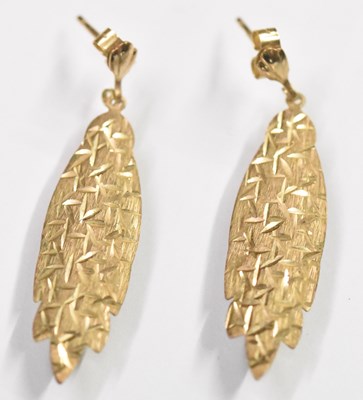 Lot 1556 - A pair of 9ct yellow gold leaf shaped earrings,...