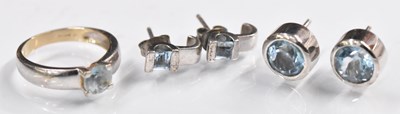 Lot 1506 - A 9ct white gold blue stone set ring, size N,...