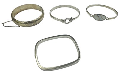 Lot 1511 - A group of four 925 hallmarked silver bangles,...