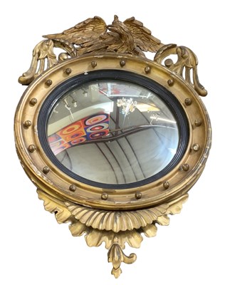 Lot 6 - A 19th century convex gilt wood circular wall...