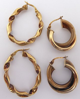 Lot 838 - Two pairs of 9ct gold hoop and twist earrings