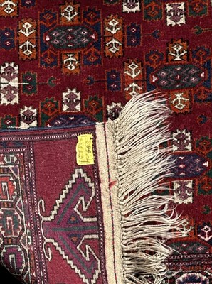 Lot 95 - A modern red ground Persian style carpet with...