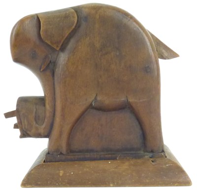 Lot 161 - An early 20th century, possibly Scottish novelty wooden elephant cigarette dispenser