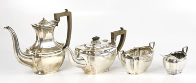 Lot 2041 - KEIGHT & CO; a hallmarked silver four piece...
