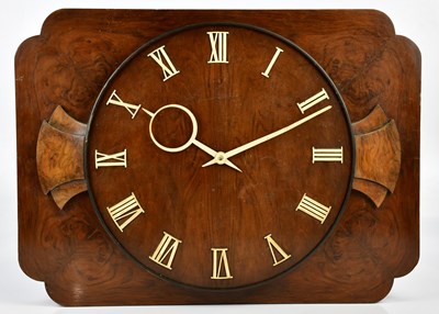 Lot 2045 - An Art Deco walnut electric wall clock, with...