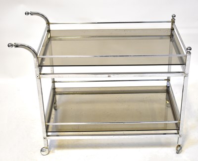Lot 10 - A smoked glass and chrome two-tier drinks...