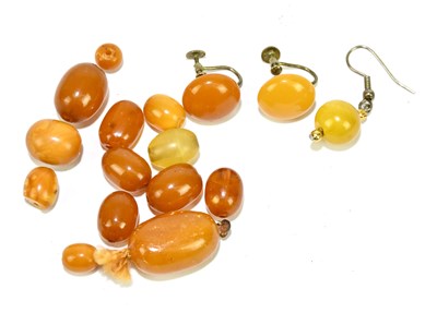 Lot 1368 - A group of loose amber beads and amber...