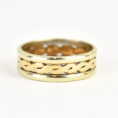 Lot 968 - A 9ct gold two-colour band ring, the open...