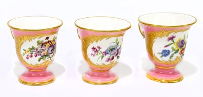 Lot 731 - SEVRES; a set of three hand painted ice cups,...