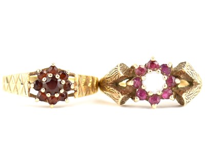 Lot 978 - Two 1970s 9ct gold ruby cluster rings, one...