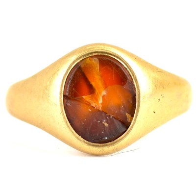 Lot 973 - A 9ct gold signet ring with central amber oval,...