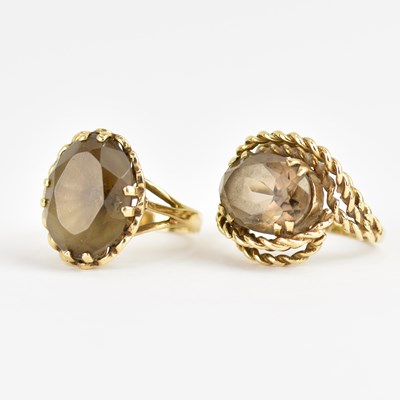 Lot 979 - Two 9ct gold dress rings, both claw set with...
