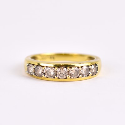 Lot 962 - An 18ct yellow gold half eternity ring set...