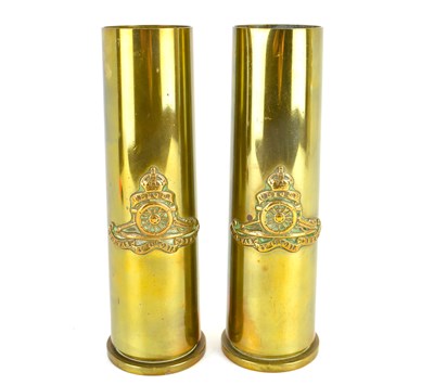 Lot 556 - Two trench art vases or poker stands, made...