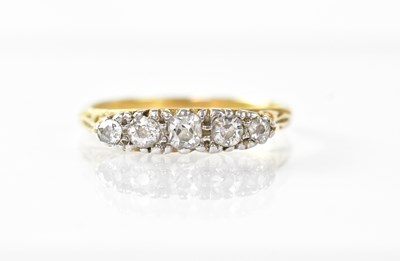 Lot 955 - An 18ct gold ring set with five graduated...
