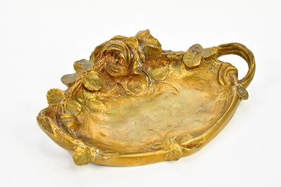 Lot 2072 - An Art Nouveau gilt bronze twin handled pin...