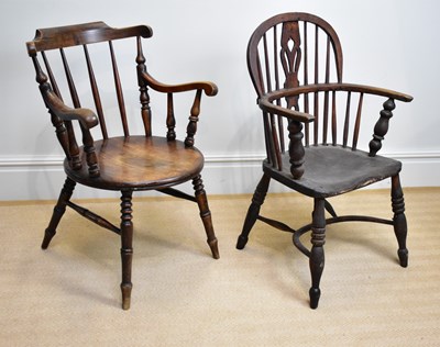 Lot 29 - A 19th century elm seated Windsor elbow chair...