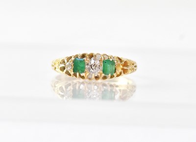 Lot 957 - An 18ct gold ring alternately claw set with...