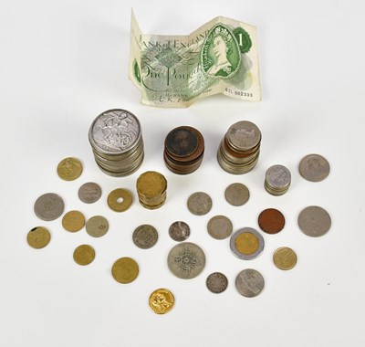 Lot 2379 - A small collection of coins to include silver...