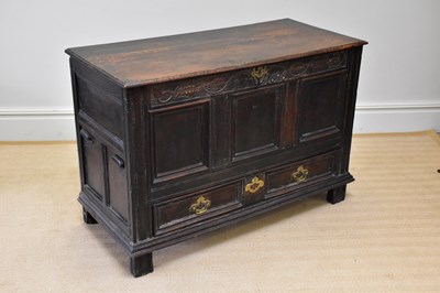 Lot 8 - A late 17th century carved oak mule chest with...